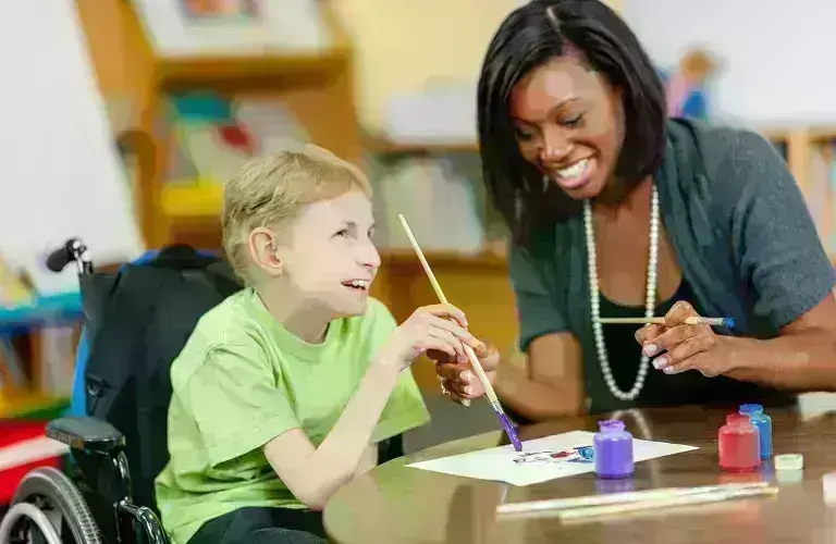 Lady working with special child