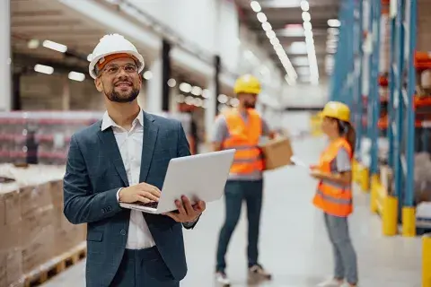 3 people working in a warehouse