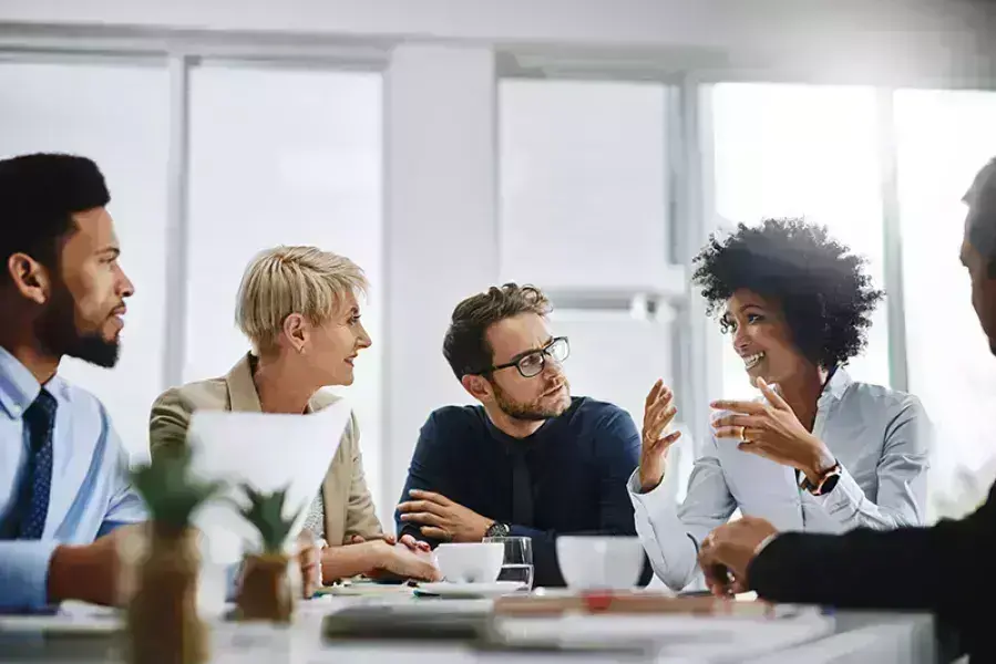 people having a conversation in meeting