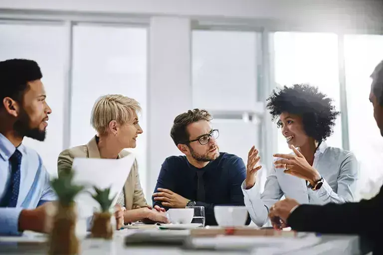 people having a conversation in meeting